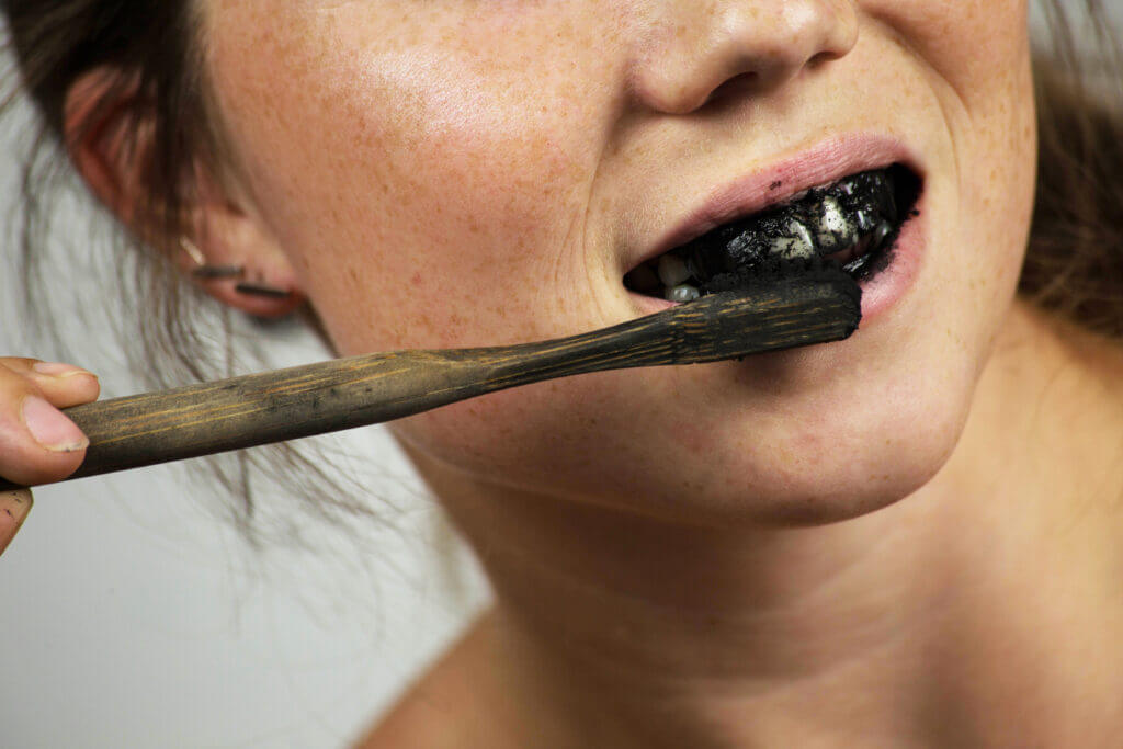 woman brushing teeth