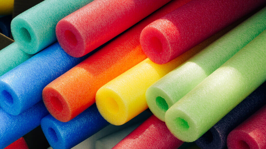 Colorful foam pool noodles.