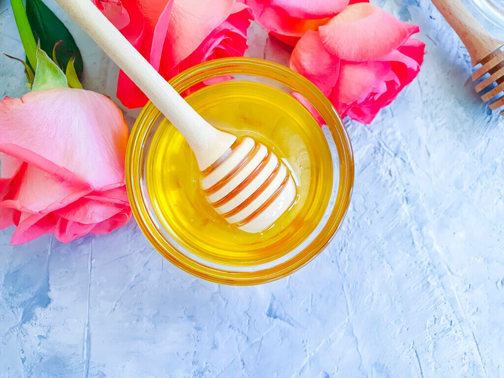 fresh honey rose flower on gray concrete background