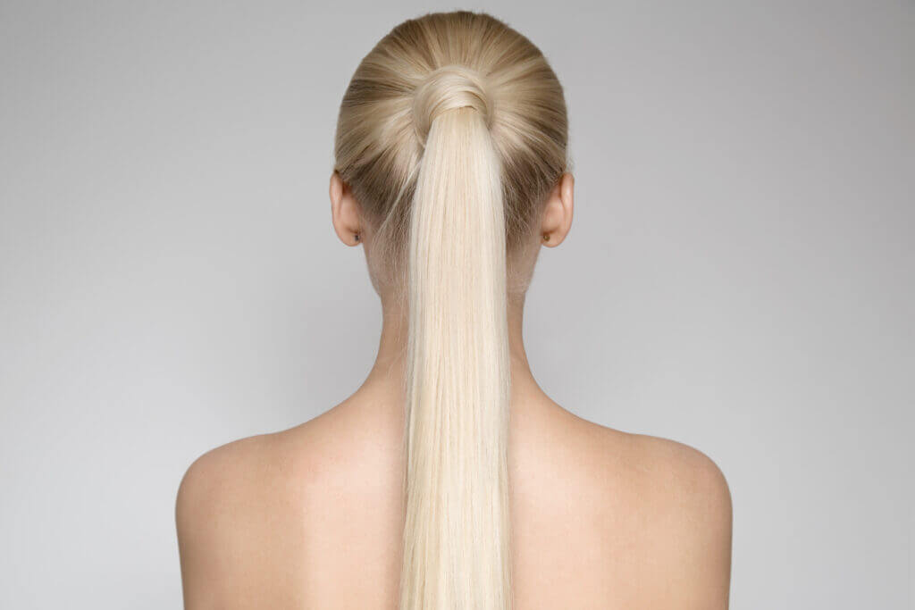 Blond Woman With Ponytail, back view