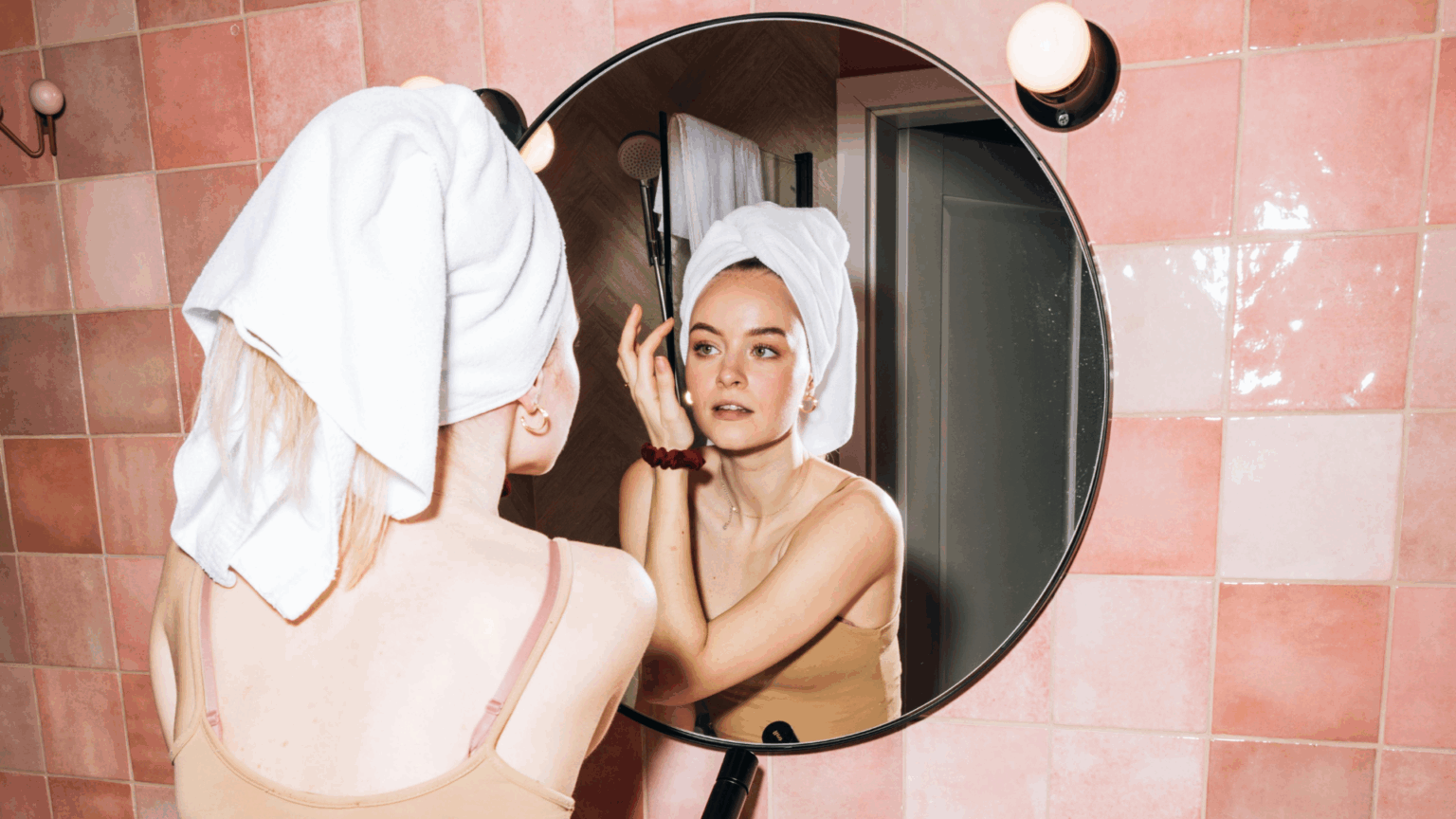 Young woman doing her skincare routine with cotton pads
