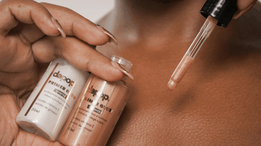 Woman holding up skincare bottles while standing in front of a mirror