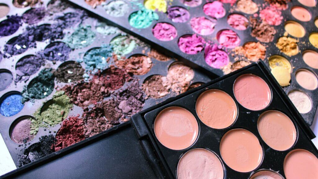 Close-up of a makeup palette with shimmery eyeshadow shades