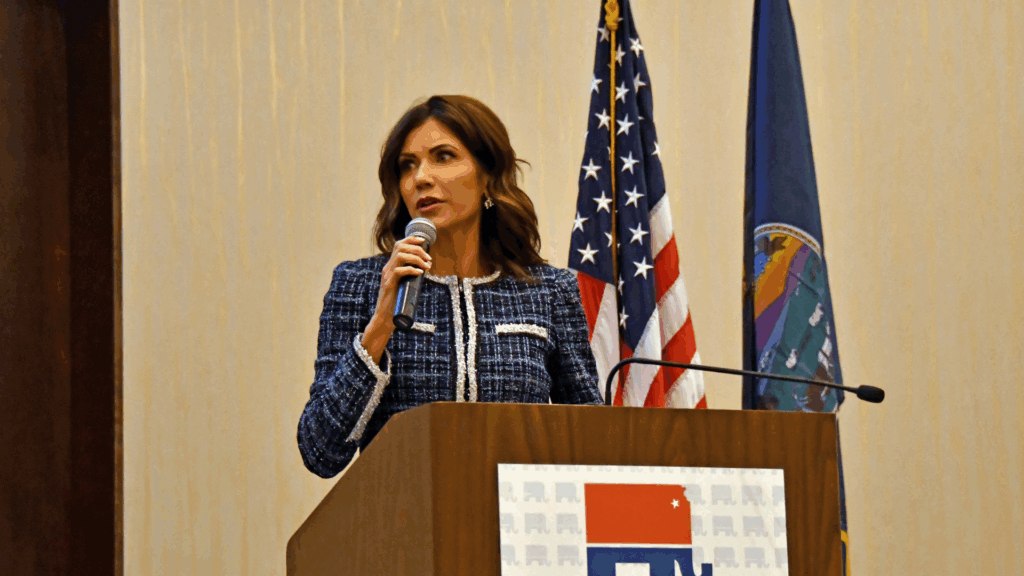 South Dakota Governor Kristi Noem addressing the Kansas State Republican Convention in Manhattan, Kansas, from a podium