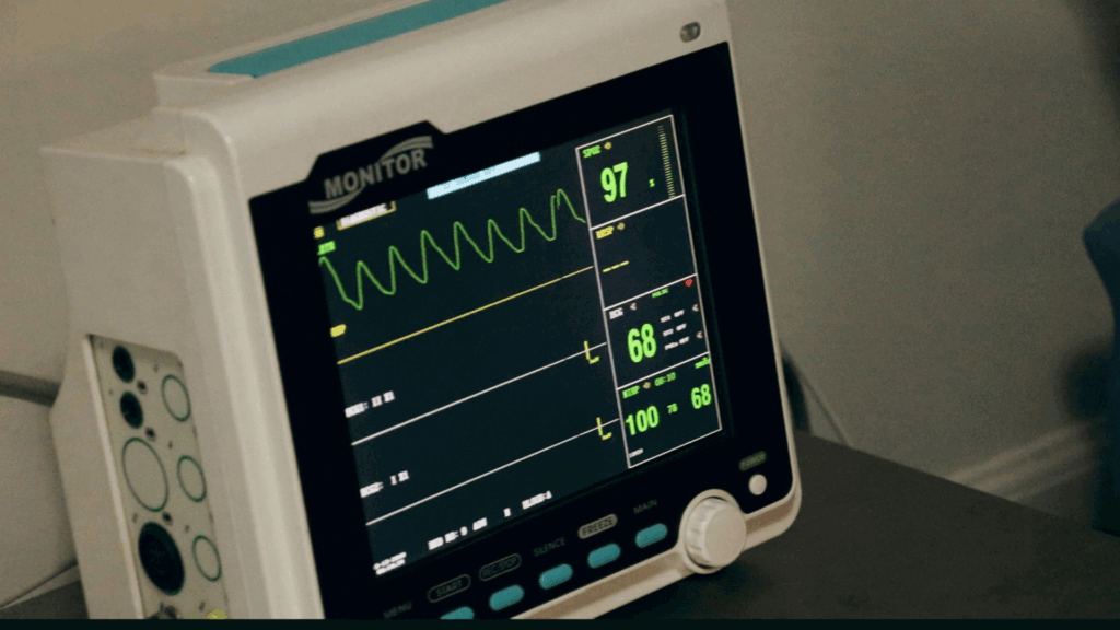 Black and white hospital heart monitor showing 97% reading