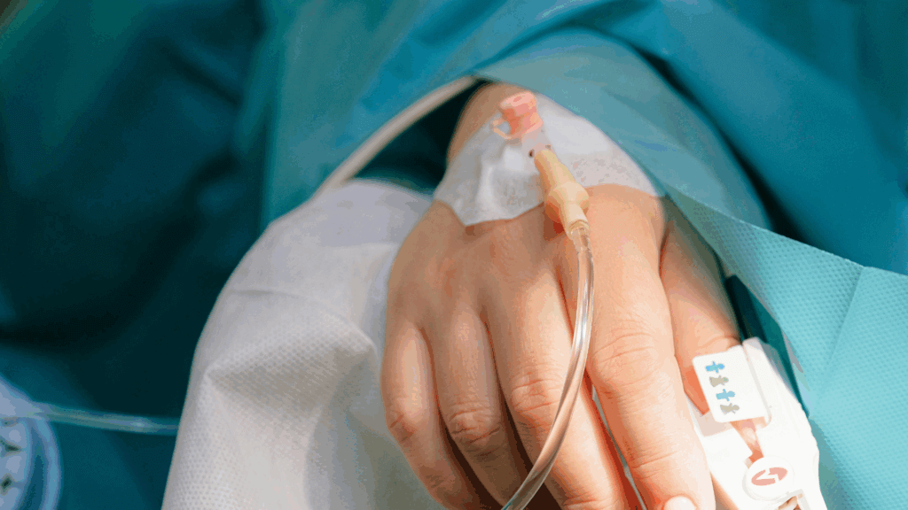 Hospital patient’s arm with IV line attached