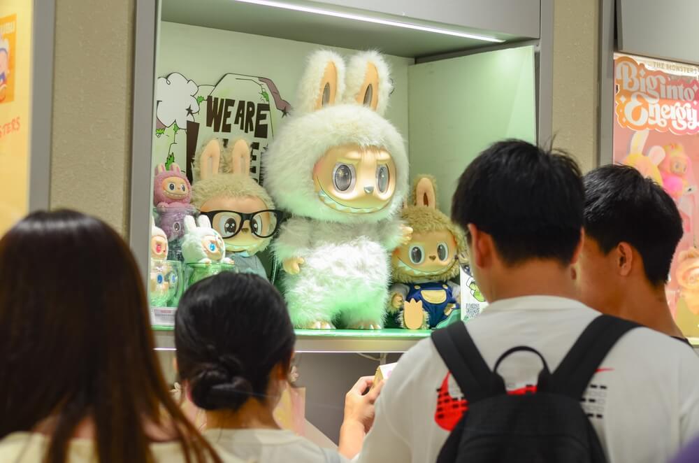 Jiangmen,Guangdong,China.14 June,2025.Customers selecting Labubu Collectibles.Chaotic scenes at Pop Mart across Guangdong Province as crowds scramble to purchase the sold-out Labubu collectibles.