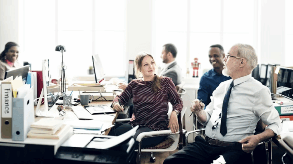 A group of workers sitting around desks