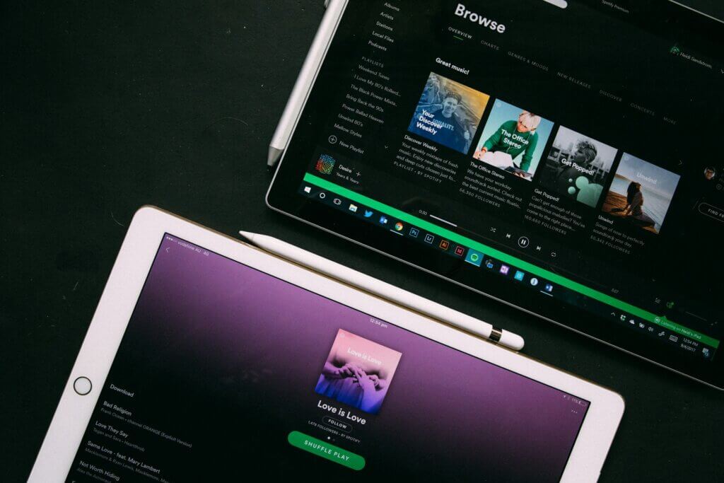 Tablets with images of music applications open on the screen