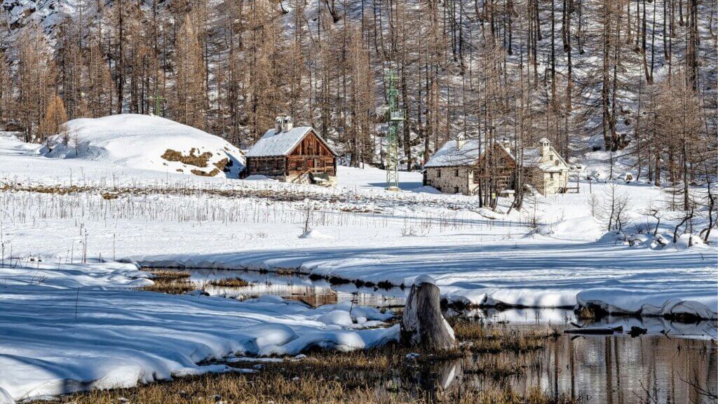Homes sitting on a snowy hill