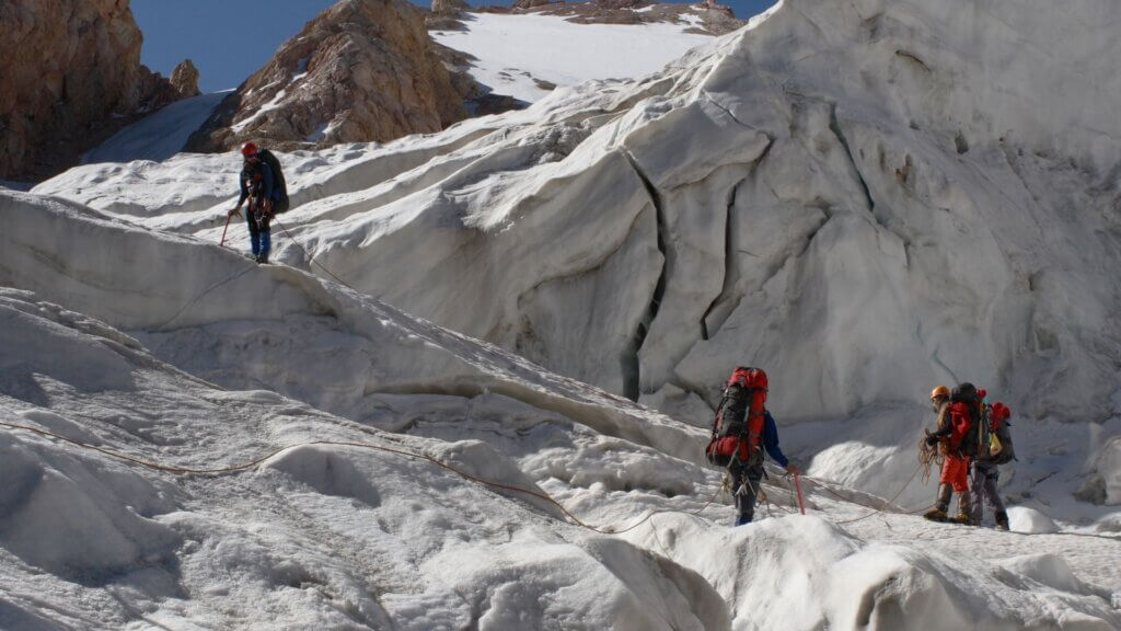 A group of people hiking up a mountain