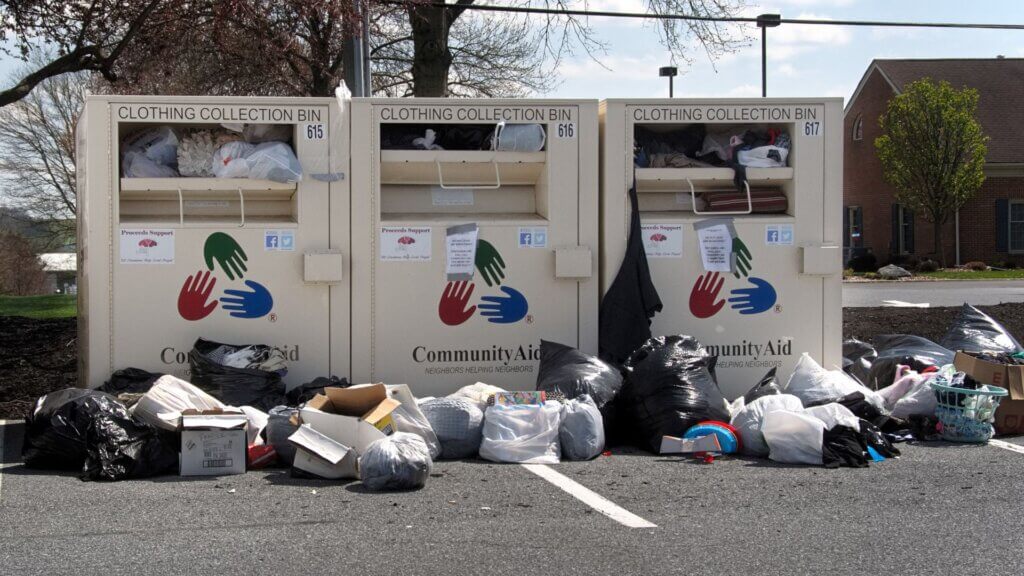 Clothing donation bins overflowing