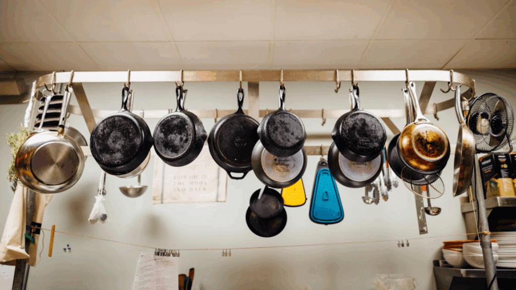hanging frying pans in the kitchen