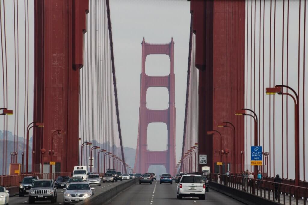 The Golden Gate Bridge with cars driving across it