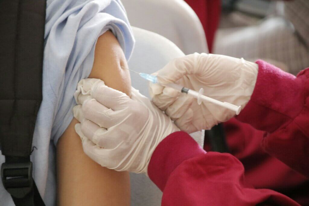 A person getting a vaccine shot