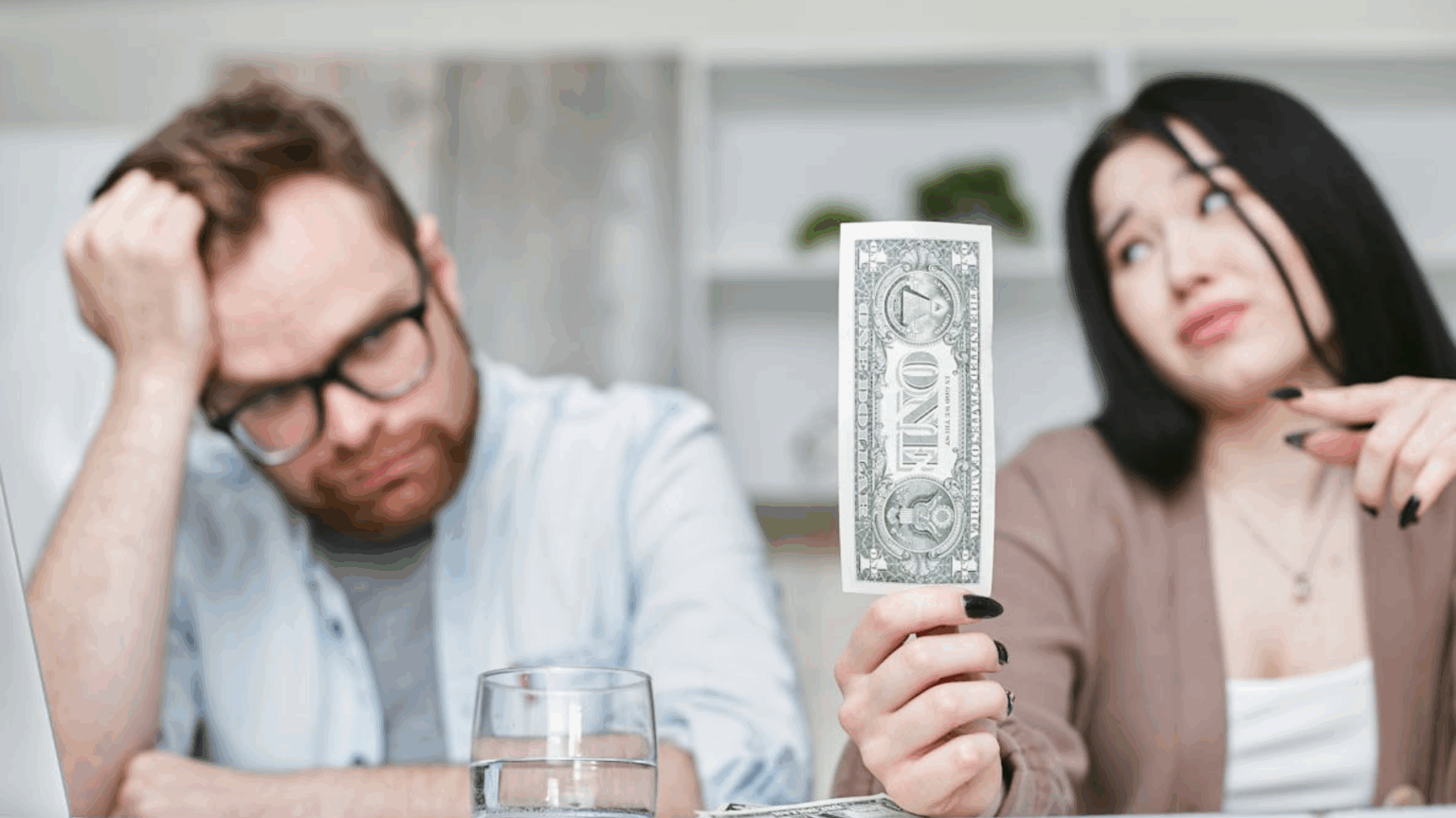 A couple looking at their last dollar