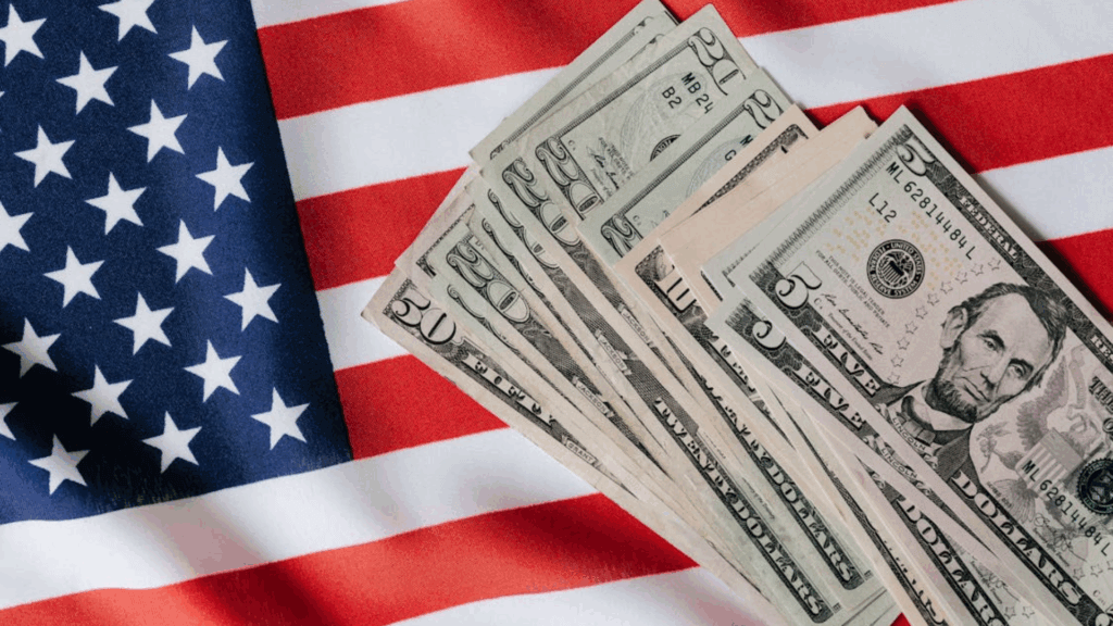 Dollar bills on the flag of America