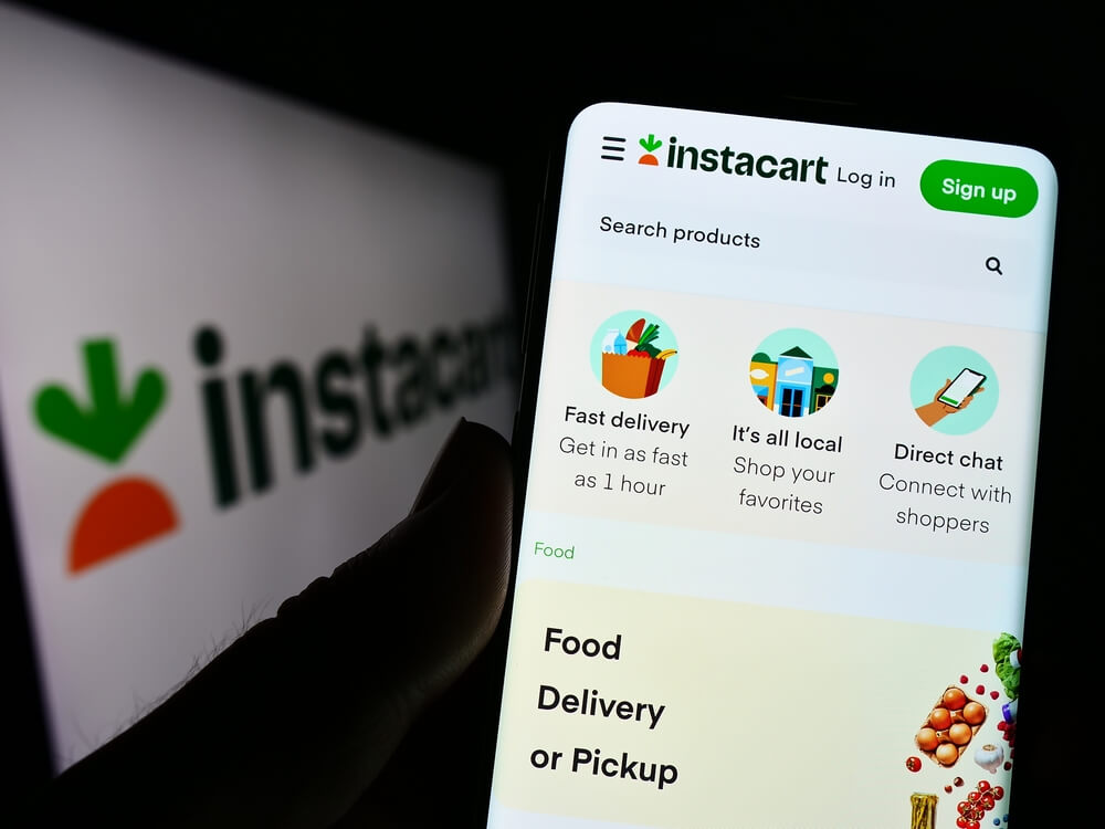 Close up of a phone displaying Instacart app
