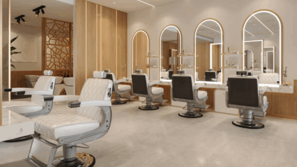 Modern hair salon with white and black styling chairs facing mirrors and light wooden walls.