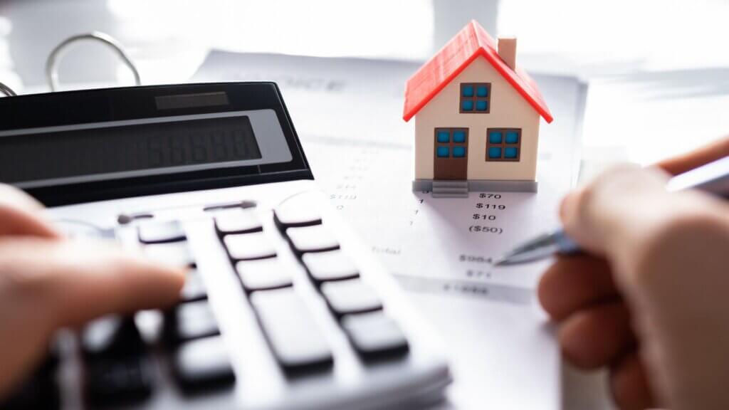 Stock photo of hands on a calculator and Property Tax documents