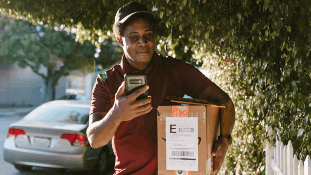 Mailman delivering Amazon package