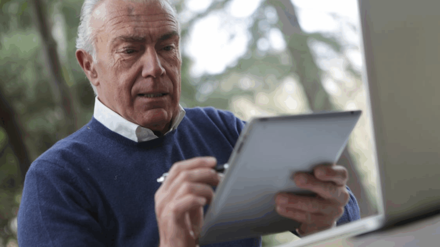 Man unhappy looking at device
