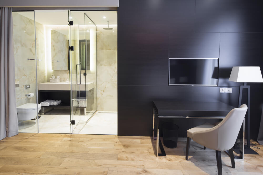 Interior of a hotel bedroom with bathroom