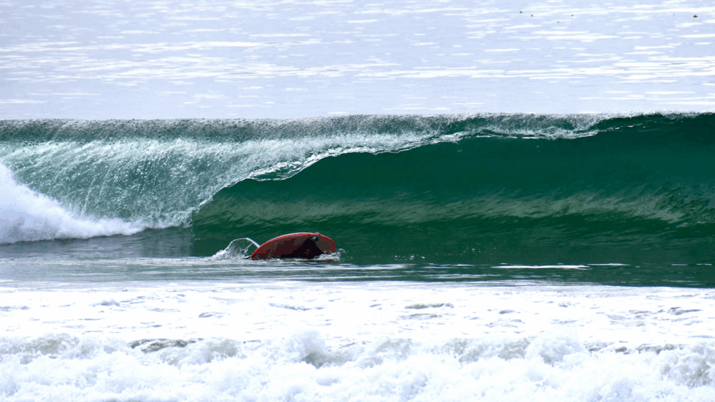 surfboard floating on wave