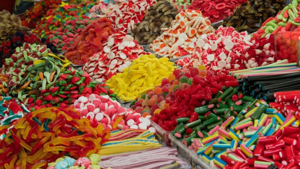 Assorted colorful hard candies piled together in a display