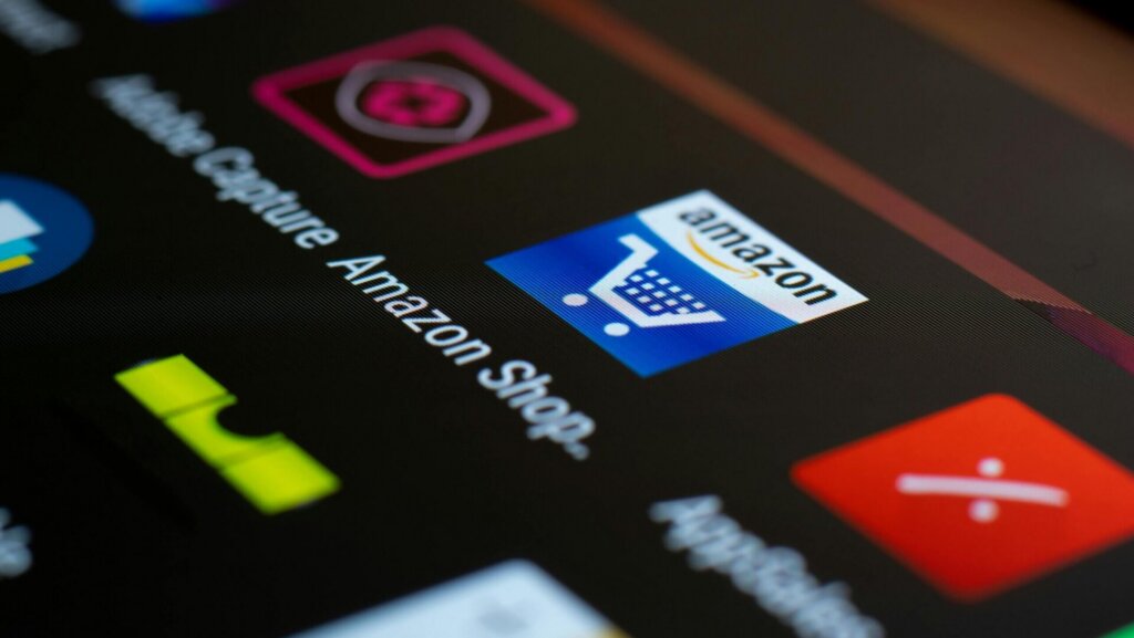 Close-up of a smartphone screen displaying multiple app icons on a dark background, highlighting a modern mobile interface.