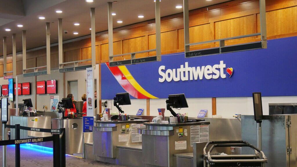 Check in counters for Southwest Airlines with passengers waiting in line