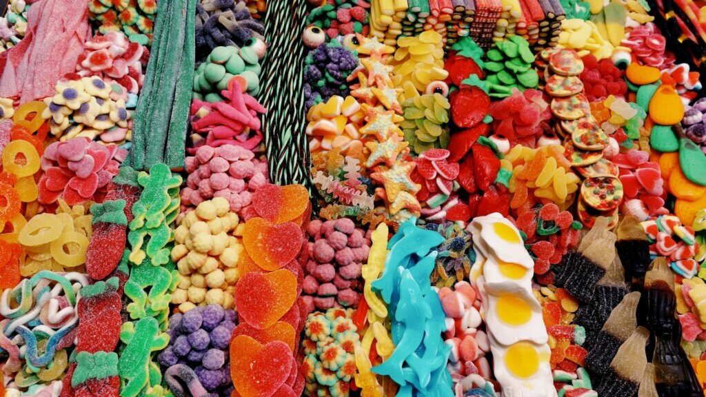 Assorted colorful fruits displayed together on a stand