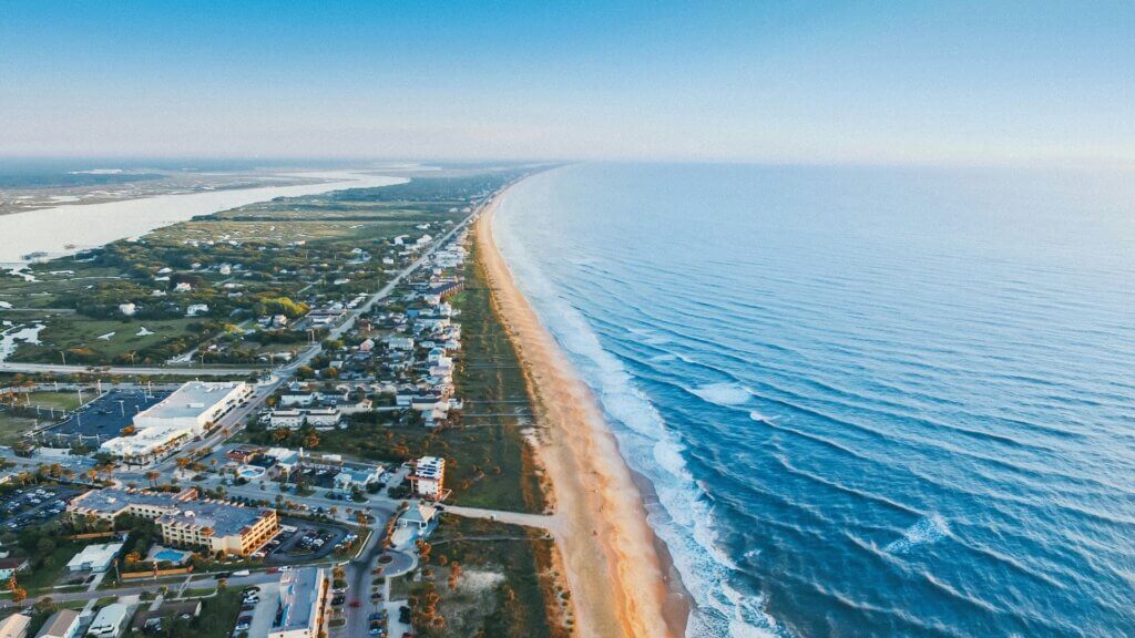 Aerial view of a Florida seaside village with homes near the water