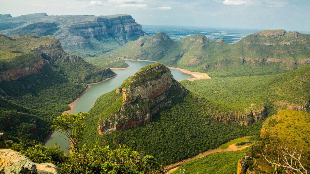Mountain landscape under blue sky with deep valley terrain