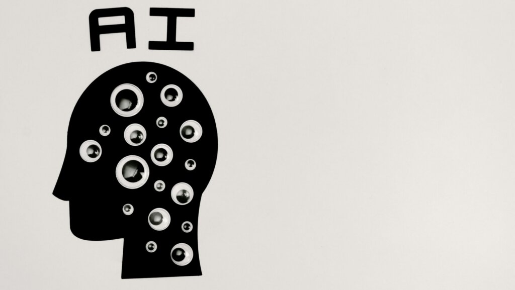 Abstract illustration of a silhouette head with multiple eyes on a wall, symbolizing artificial intelligence and observation.