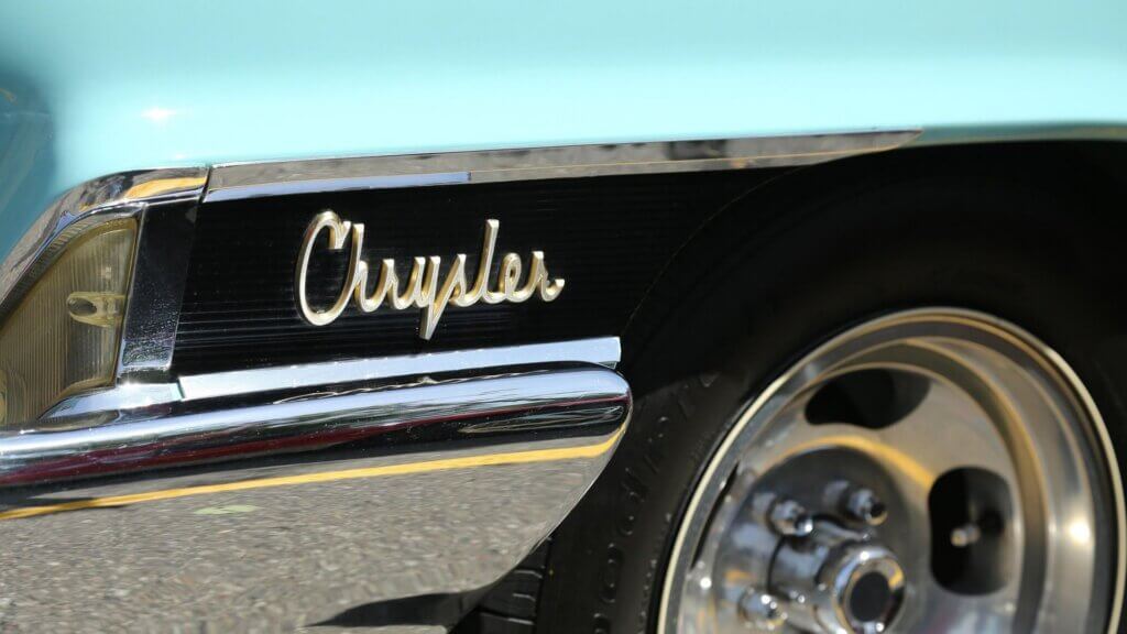 Vintage Chrysler car displayed outdoors with chrome detailing