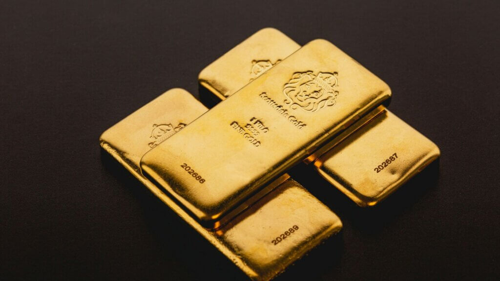 Three gold bars stacked on top of each other
