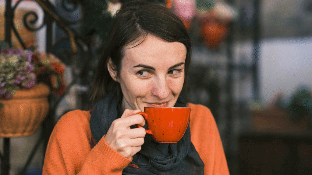 a woman enjoying a cup of coffee