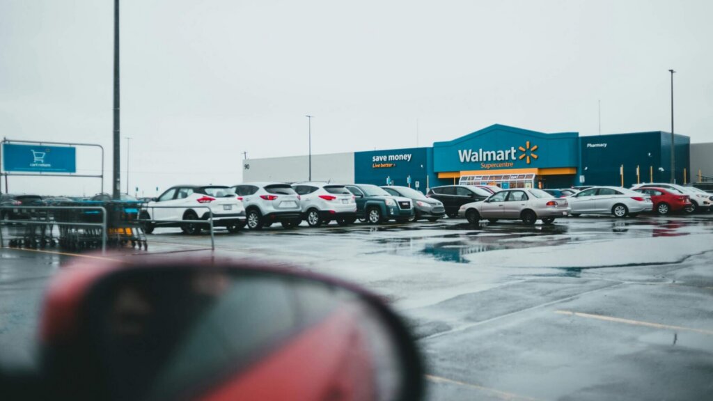 Car parked in a parking lot outside a Walmart.
