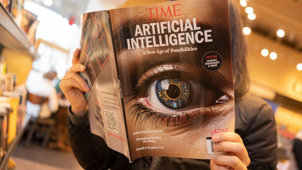 Woman reading a magazine issue focused on artificial intelligence and the future of technology