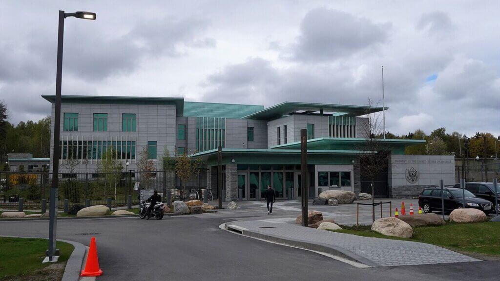 Exterior of the U.S. Embassy in Helsinki, Finland, under cloudy skies.