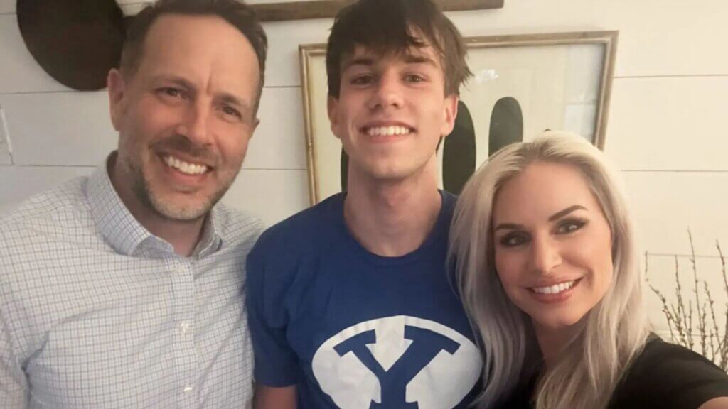 Owen Johansen (center) stands with his father, Aaron Johansen, and his mother, Talai Johansen.