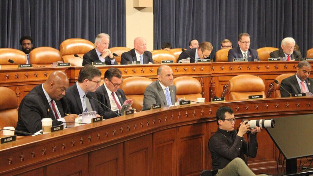 Members of the U.S. House of Representatives seated during a congressional committee hearing.