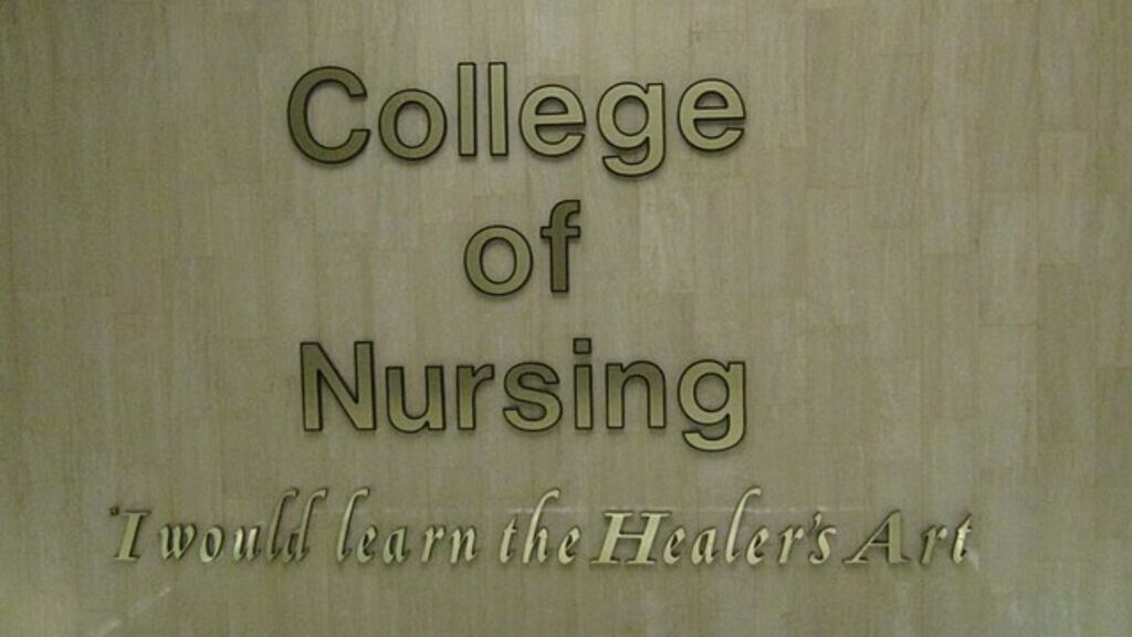 Sign reading College of Nursing with the phrase “I would learn the Healer’s Art.”