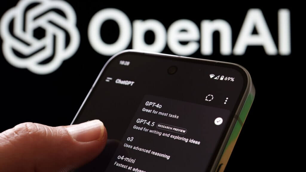 Smartphone showing ChatGPT model options in front of an OpenAI logo.