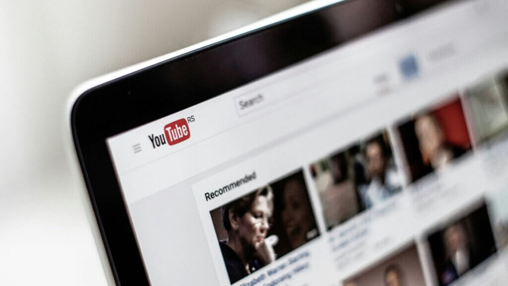 The main screen of a computer with youtube app opened in the deskstop.