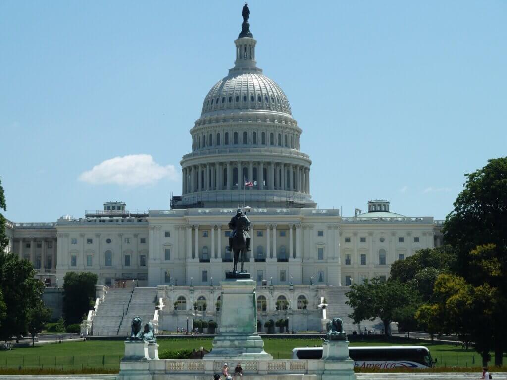 U.S. Capitol building with dome and statue in front in Washington, D.C.