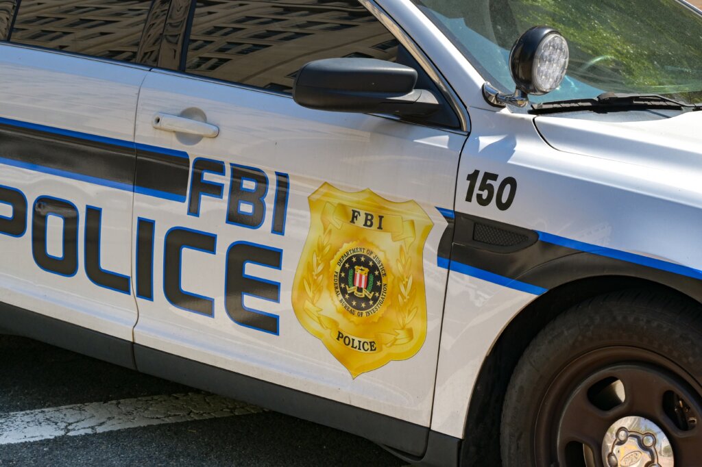 FBI police car with agency badge on door.