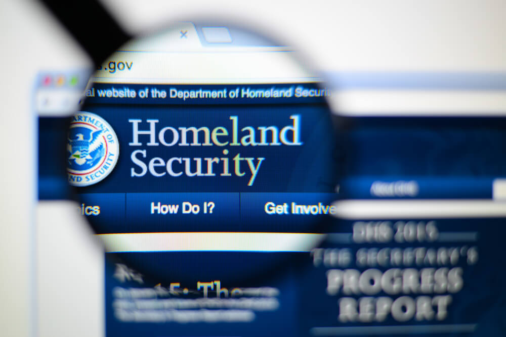 Department of Homeland Security website homepage displayed on a computer screen under magnification.