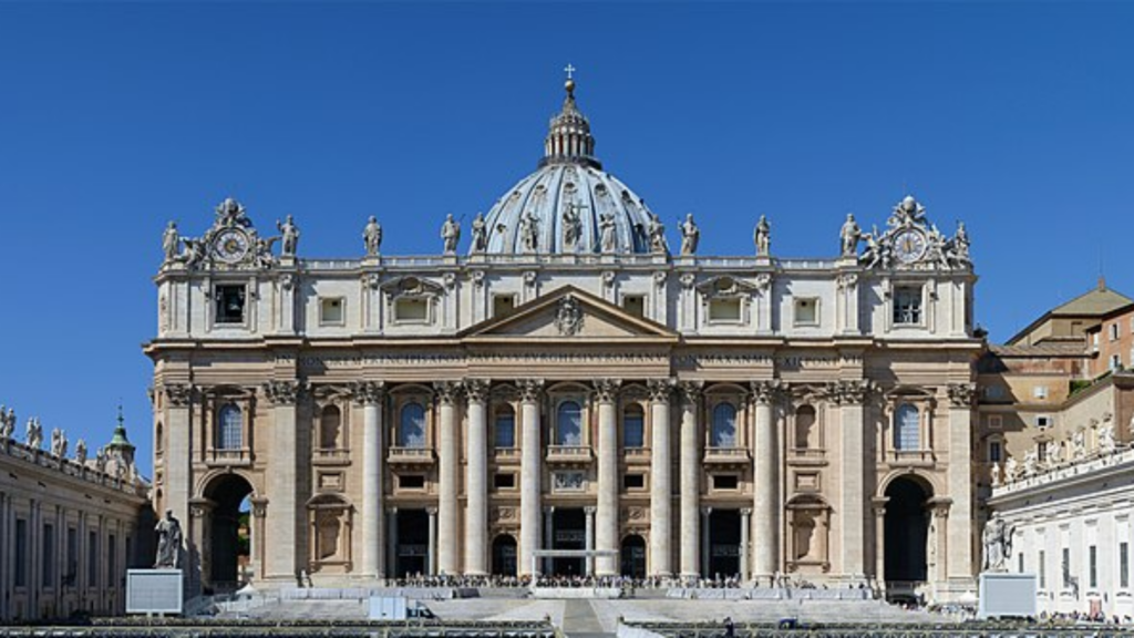 A wide exterior view of the large, historic St. Peter's Basilica building.